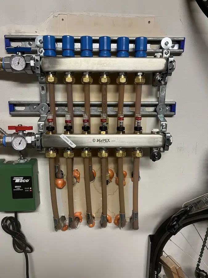 Plumber performing Water Heater Repair at a residential property in Owego